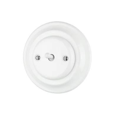 Interrupteur à bouton rond en porcelaine blanche à montage encastré 1 gang 1 voie décoré sur le mur